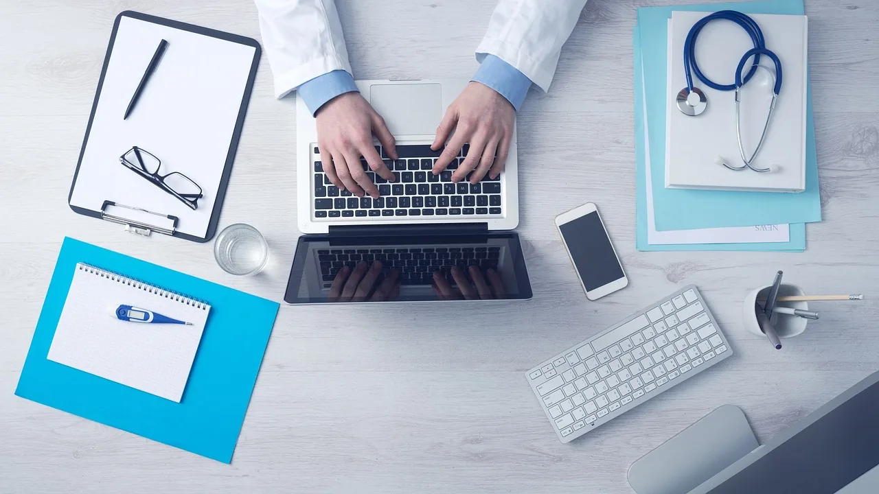 Doctor’s desk with a laptop and stethoscope